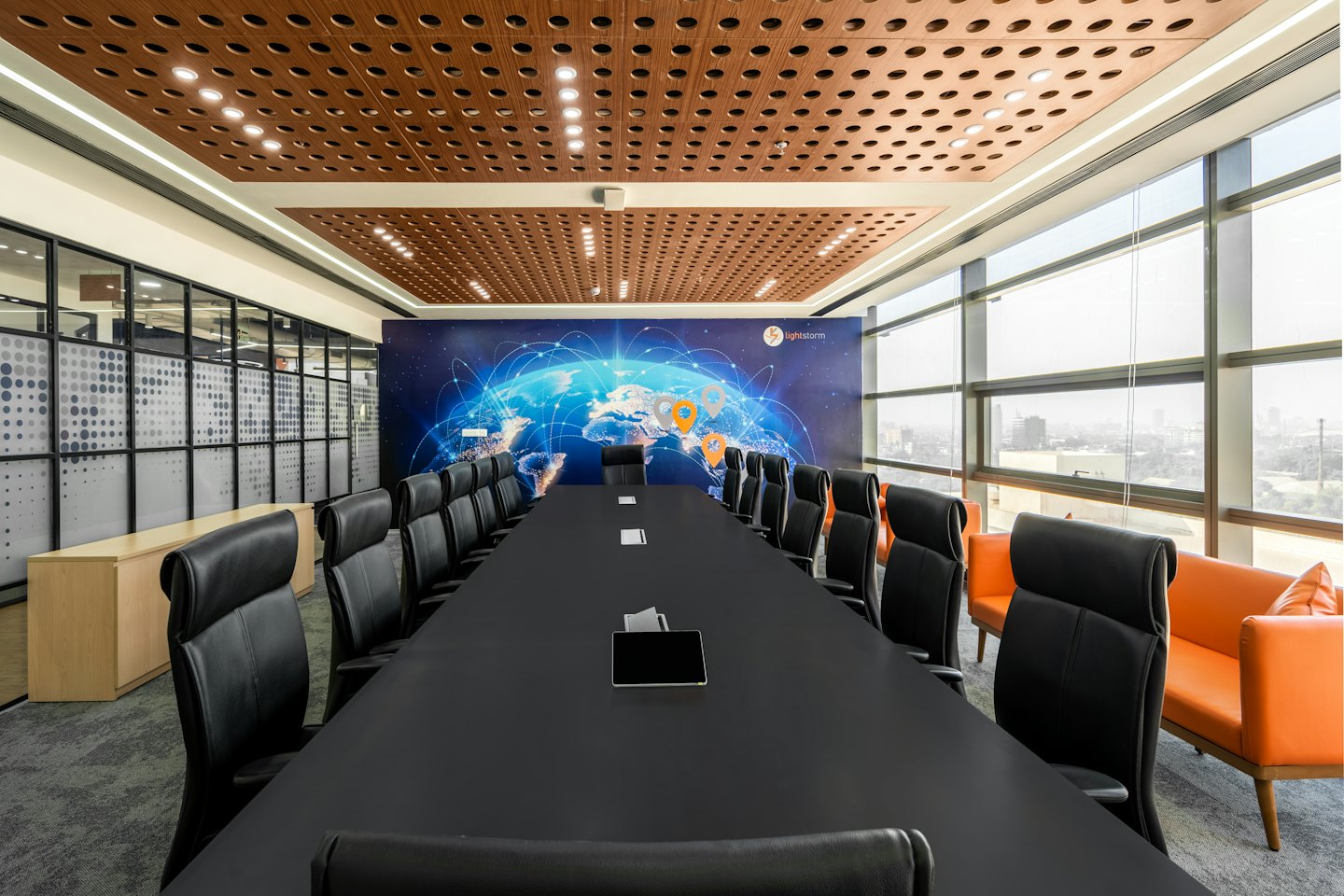 Modern conference room with a large table and wall mural.